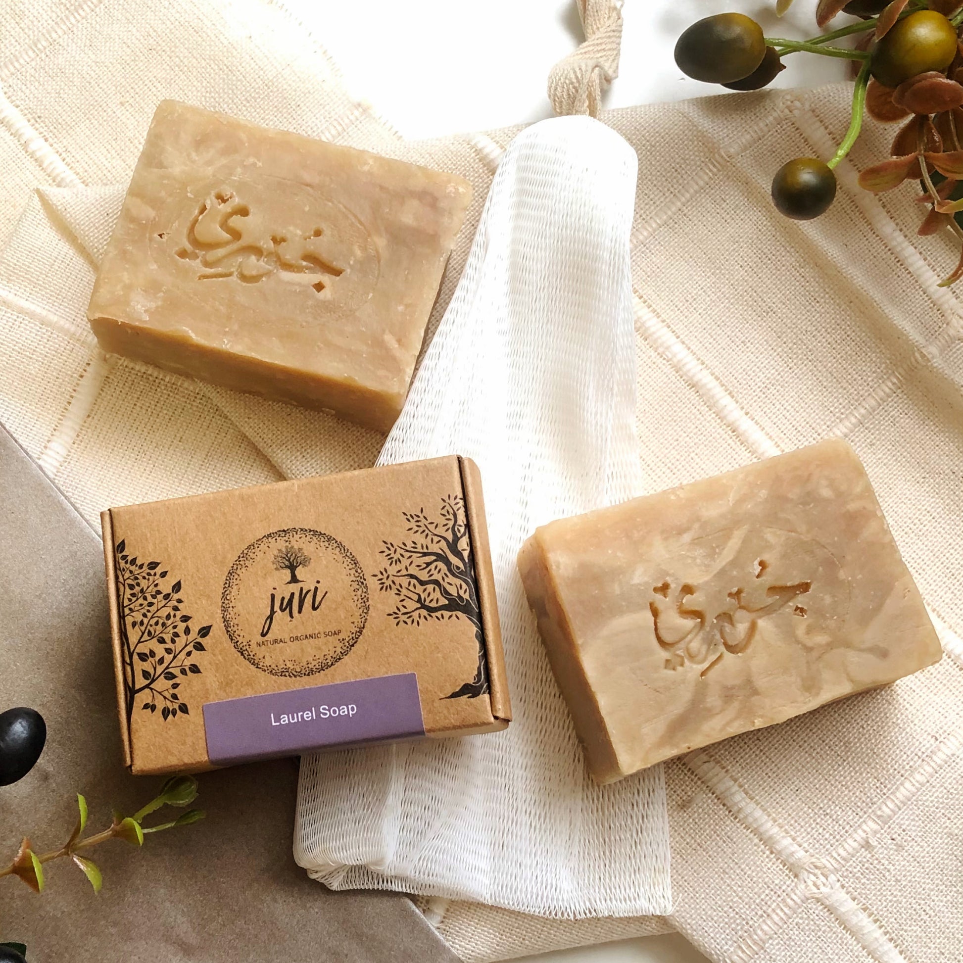 Organic soap Juri's Soap with laurel aroma in a natural setting for effective face care.