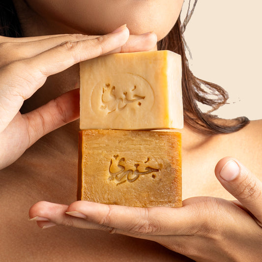 Organic soap Juri's Soap held in hands, showcasing natural skincare benefits and elegant design.