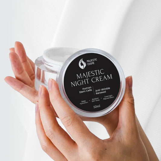 Majestic Night Cream featuring Japanese stem cell technology for anti-wrinkle renewal, held in hand.